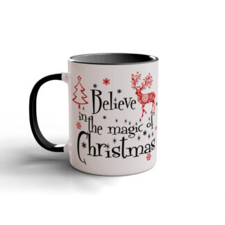 White ceramic mug with black rim and handle, featuring "Believe in the magic of Christmas" text, red snowflakes, tree, and reindeer design.